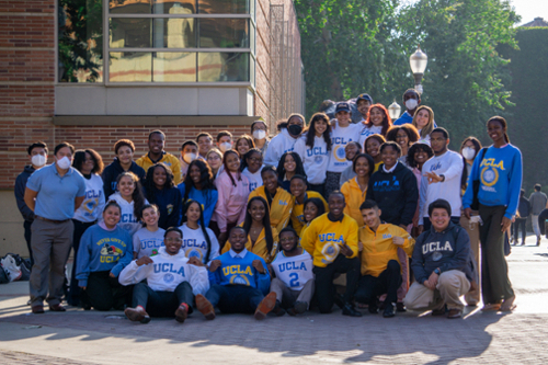 Group photo of the SIEML 2022 cohort on the UCLA campus wearing UCLA sweatshirts