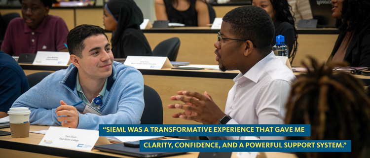 Two students in a workshop discussion