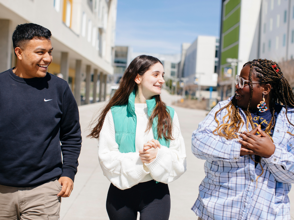 3 students walking outside