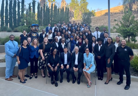 Photo of 50 scholars plus representatives from the UC system at UC Riverside.
